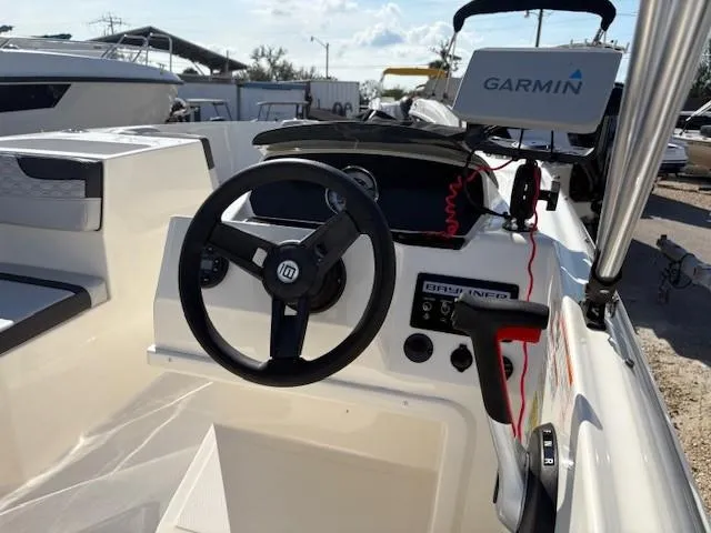 Slide: The Image of 2023 Bayliner Element M17 boat interior with Garmin navigation system. - 7
