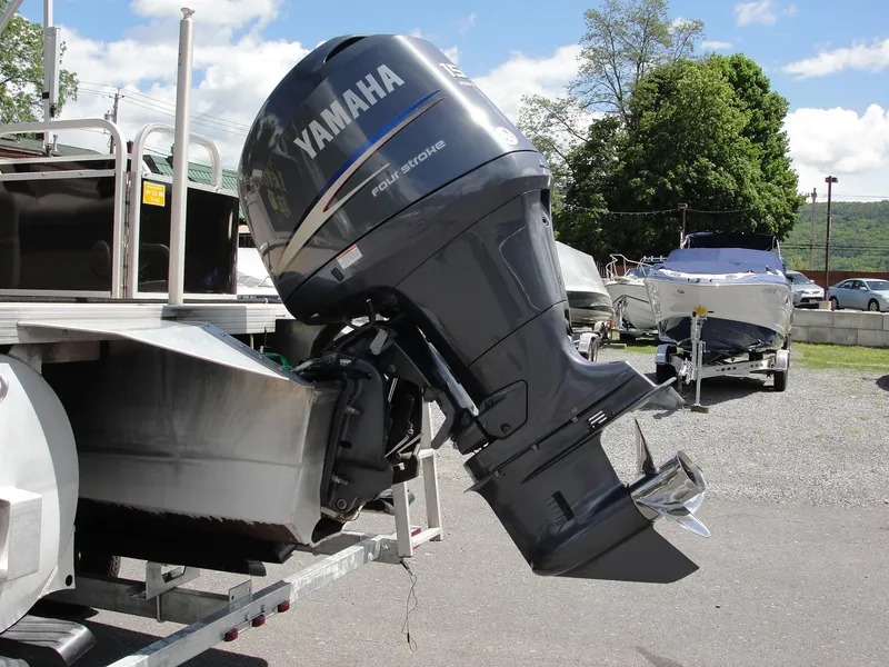 Slide: The Image of 2012 Veranda RFL2575V with Yamaha outboard motor on a trailer. - 10