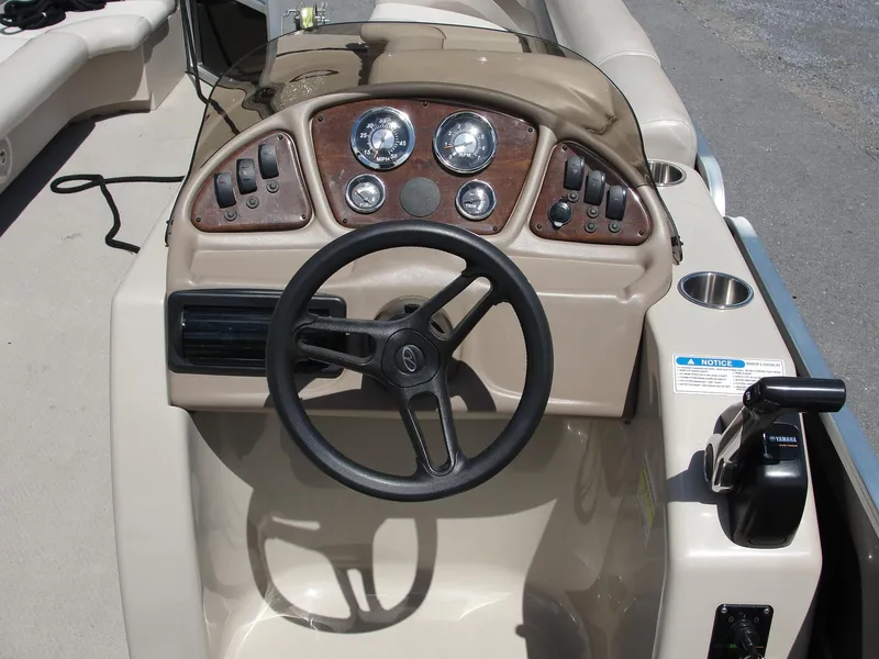 Slide: The Image of Steering console of 2012 Veranda RFL2575V boat with gauges and controls. - 12