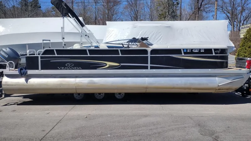 Slide: The Image of 2012 Veranda RFL2575V pontoon boat on trailer, black and silver design. - 28