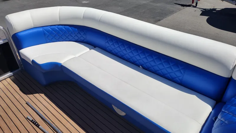 Slide: The Image of Luxurious seating on 2012 Veranda RFL2575V boat with blue and white upholstery. - 34