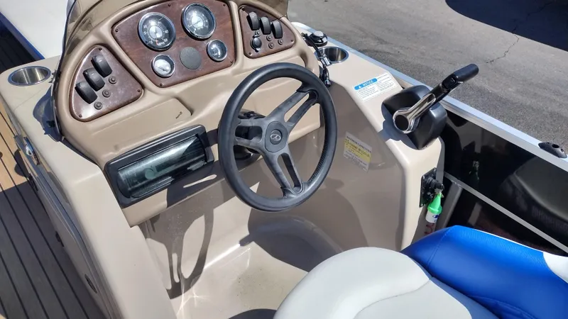 Slide: The Image of Steering console of 2012 Veranda RFL2575V boat with gauges and controls. - 36