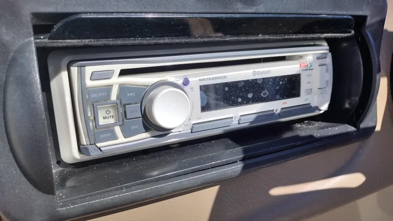 Slide: The Image of 2012 Veranda RFL2575V stereo system with Bluetooth and mute button in dashboard. - 42
