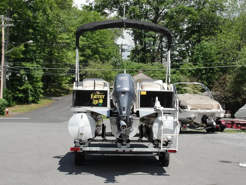 Slide: The Image of 2012 Veranda RFL2575V pontoon boat on trailer, parked outdoors. - 8