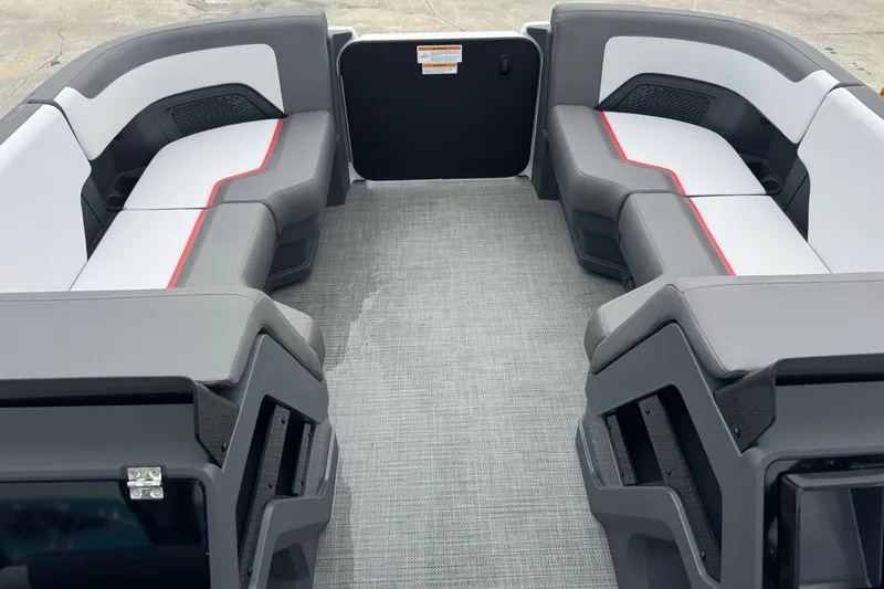 Slide: The Image of 2025 Manitou 22' Cruise Switchback interior with modern seating and spacious layout. - 2