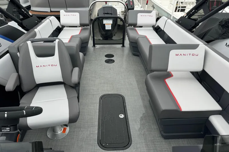 Slide: The Image of 2025 Manitou 22' Cruise Switchback interior with modern seating and sleek design. - 3