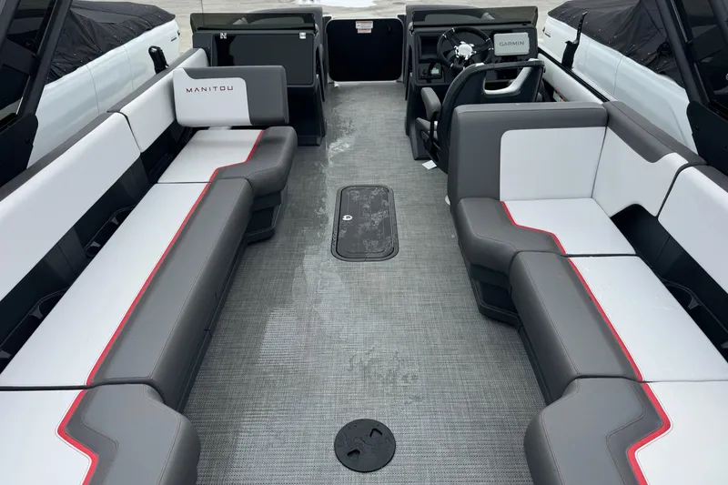 Slide: The Image of 2025 Manitou 22' Cruise Switchback interior with gray and white seating. - 4