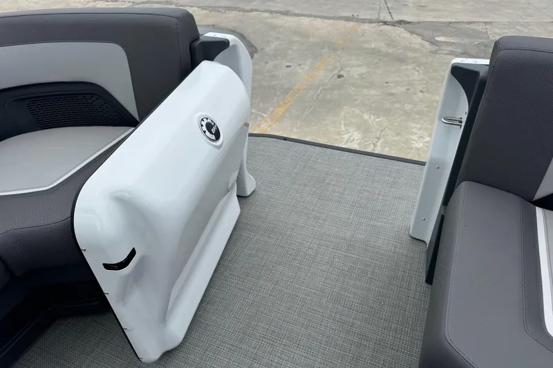 Slide: The Image of 2025 Manitou 22' Cruise Switchback interior with open gate and seating. - 3