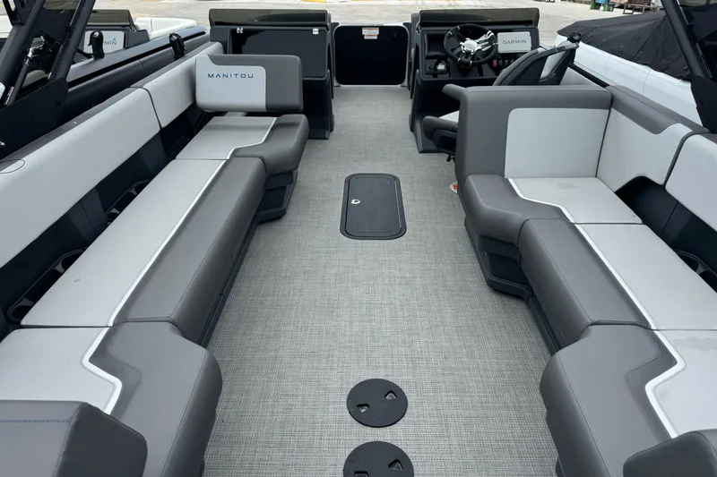Slide: The Image of 2025 Manitou 22' Cruise Switchback interior with gray seating and modern design. - 6