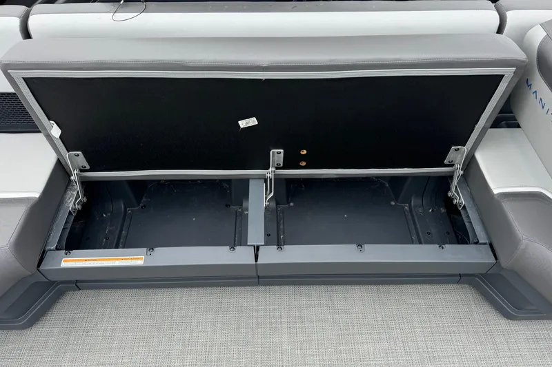Slide: The Image of Open storage compartment in 2025 Manitou 22' Cruise Switchback boat. - 8