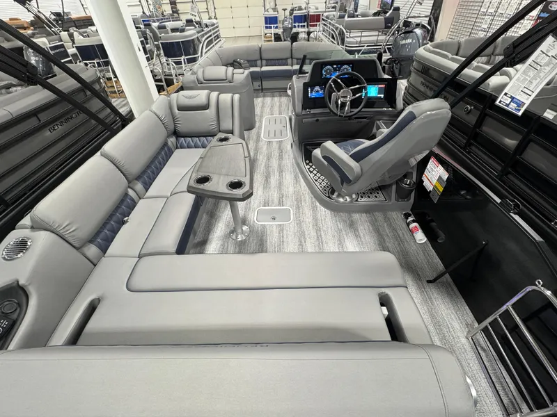 Slide: The Image of 2025 Bennington 25 RSB pontoon boat interior with luxurious seating and modern helm. - 11