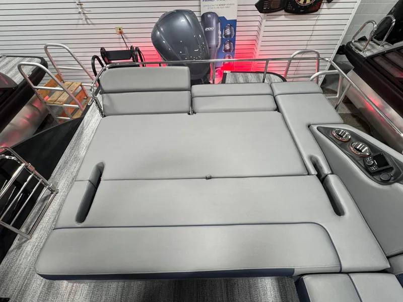 Slide: The Image of 2025 Bennington 25 RSB boat interior with spacious gray seating and modern design. - 16