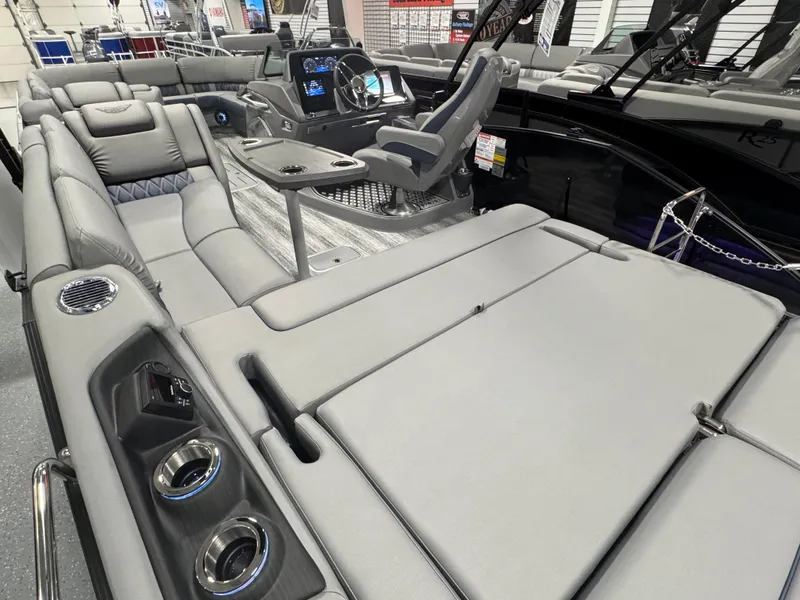 Slide: The Image of 2025 Bennington 25 RSB boat interior with luxurious seating and modern dashboard. - 17