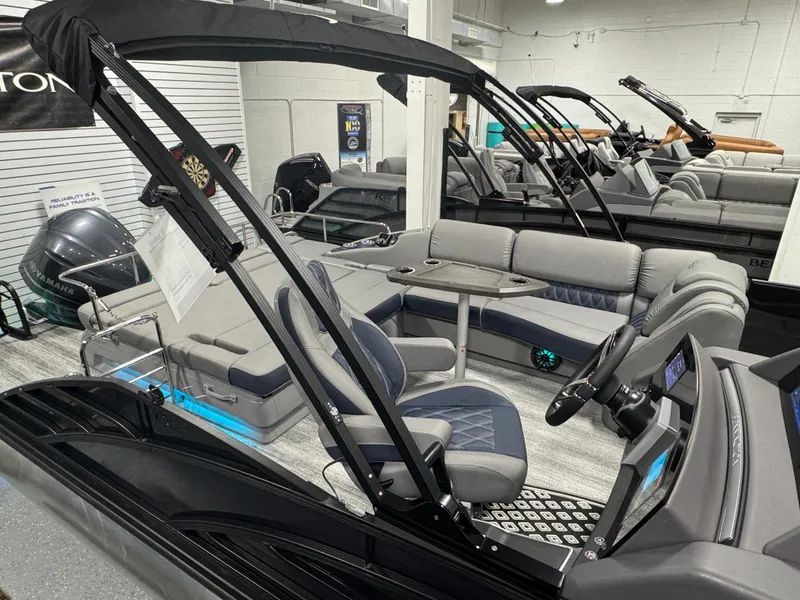 Slide: The Image of 2025 Bennington 25 RSB pontoon boat interior with modern seating and helm. - 20