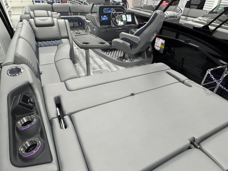 Slide: The Image of Luxurious interior of 2025 Bennington 25 RSB pontoon boat with plush seating and modern controls. - 21