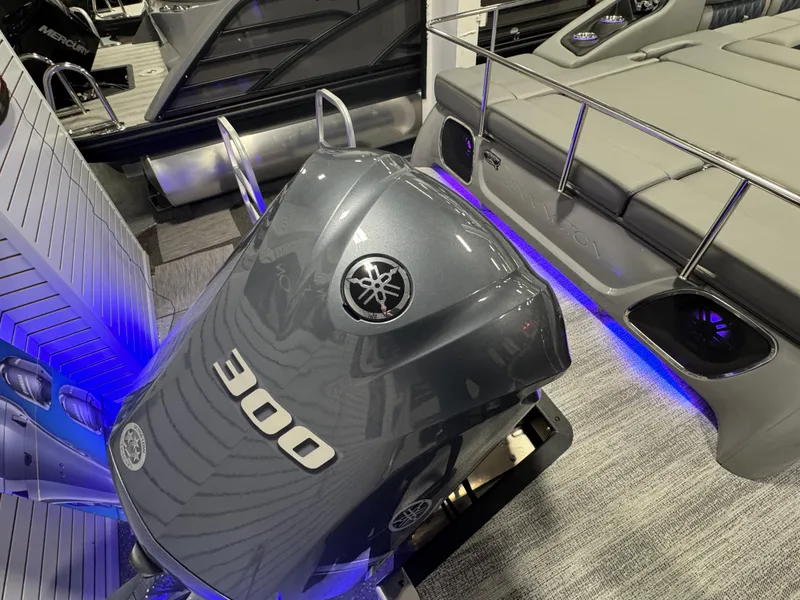 Slide: The Image of 2025 Bennington 25 RSB boat with Yamaha 300 outboard engine, featuring sleek design and blue LED lighting. - 26