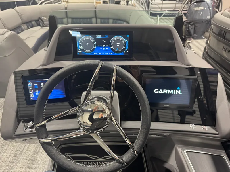 Slide: The Image of 2025 Bennington 25 RSB boat dashboard with Garmin navigation system and digital displays. - 3