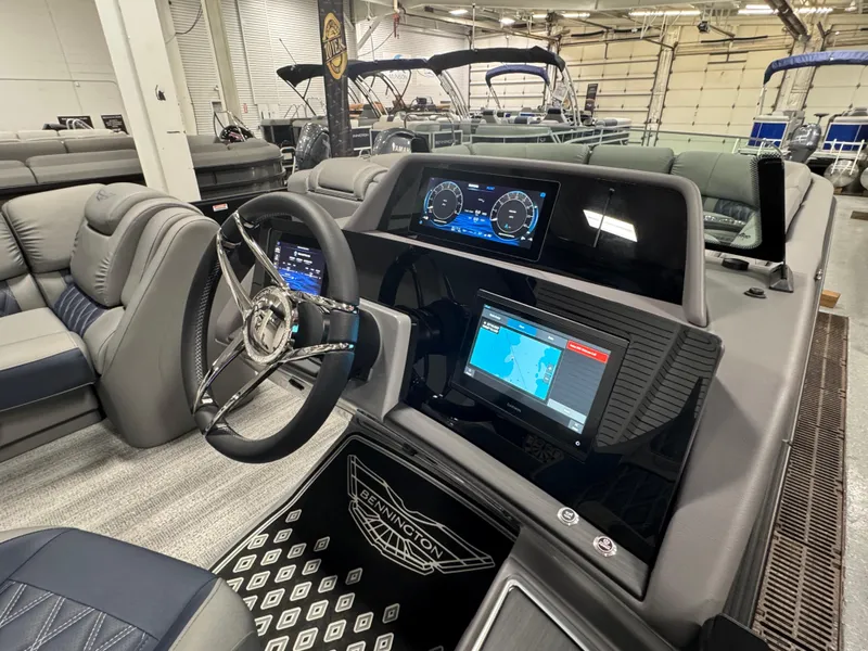 Slide: The Image of 2025 Bennington 25 RSB boat interior with modern dashboard and steering wheel. - 9