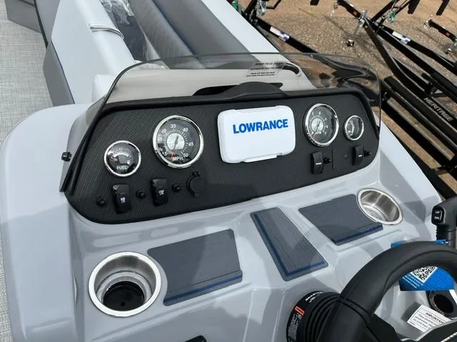 Slide: The Image of Control panel of 2025 Veranda Vista Sport 25RC boat with Lowrance display and gauges. - 13