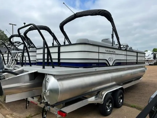 Slide: The Image of 2025 Veranda Vista Sport 25RC pontoon boat on trailer, parked outdoors. - 3