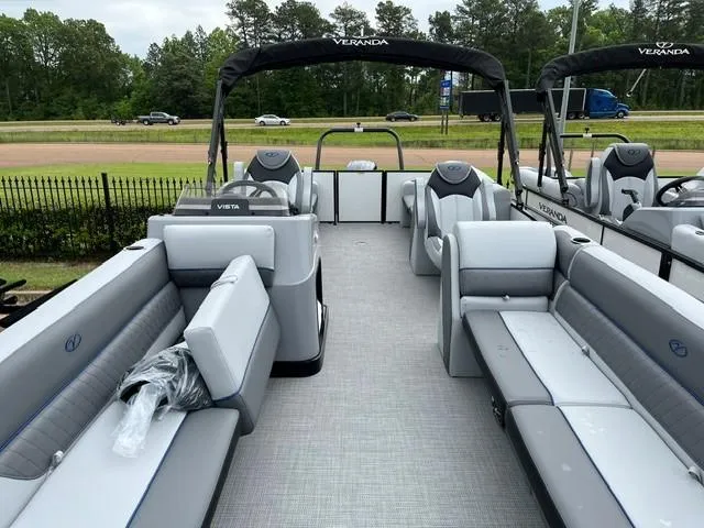 Slide: The Image of 2025 Veranda Vista Sport 25RC pontoon boat with spacious seating and modern design. - 8