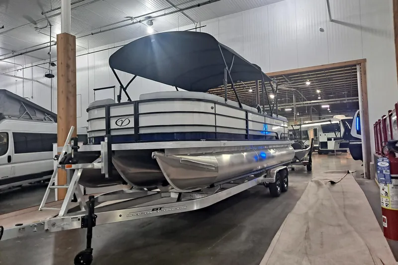 The Image of 2025 Veranda Vista Sport 25RC pontoon boat in indoor storage facility. - 0