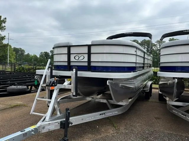 Slide: The Image of 2025 Veranda Vista Sport 25RC pontoon boat on trailer, parked outdoors. - 2
