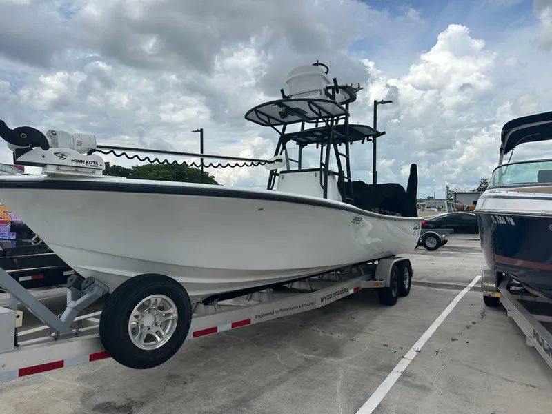 Slide: The Image of 2021 Canyon Bay 28 Hybrid boat on trailer under cloudy sky. - 13