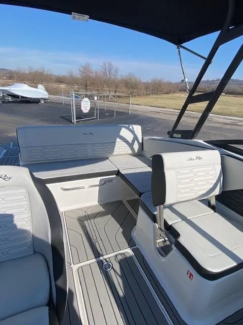 Slide: The Image of 2025 Sea Ray SPX 210 boat interior with white seating and sleek design. - 6