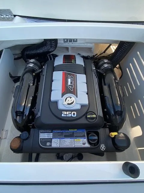Slide: The Image of 2025 Sea Ray SPX 210 engine compartment showcasing powerful 250 horsepower engine. - 9