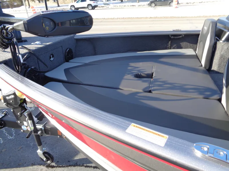 Slide: The Image of 2025 Lund 1875 Impact XS Sport boat interior with seating and trolling motor. - 6
