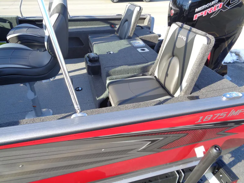 Slide: The Image of 2025 Lund 1875 Impact XS Sport boat interior with seating and Mercury Pro outboard motor. - 9