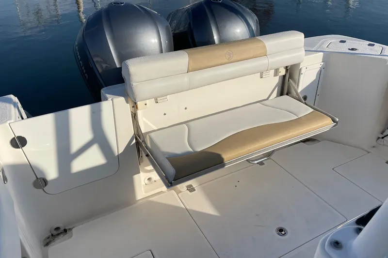 Slide: The Image of Edgewater 280CC 2015 boat with foldable bench seat and dual outboard motors. - 10