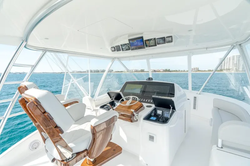Slide: The Image of Luxurious helm of 2025 Viking 54 Convertible yacht with advanced navigation systems. - 10