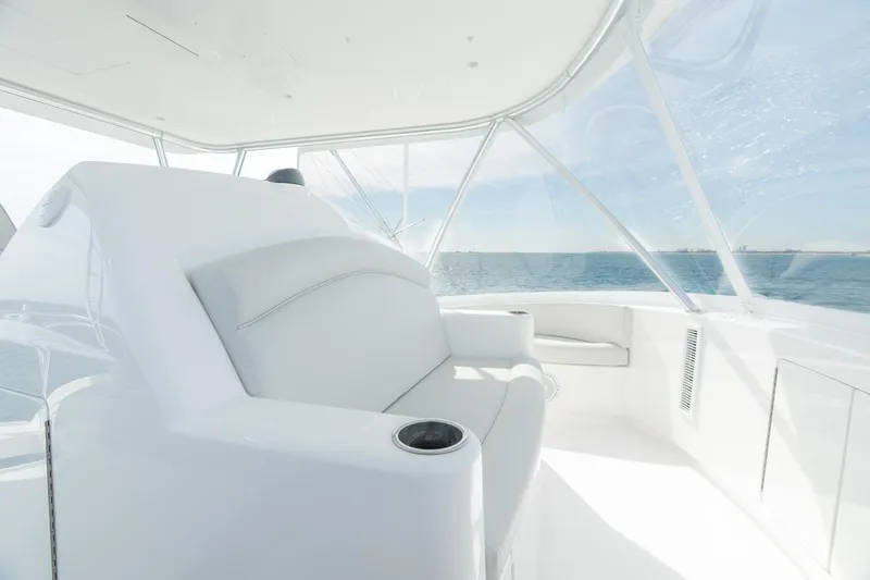 Slide: The Image of Luxurious interior of 2025 Viking 54 Convertible yacht with ocean view. - 14