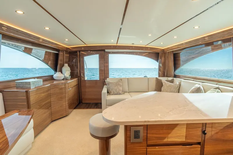 Slide: The Image of Luxurious interior of 2025 Viking 54 Convertible yacht with ocean view. - 17