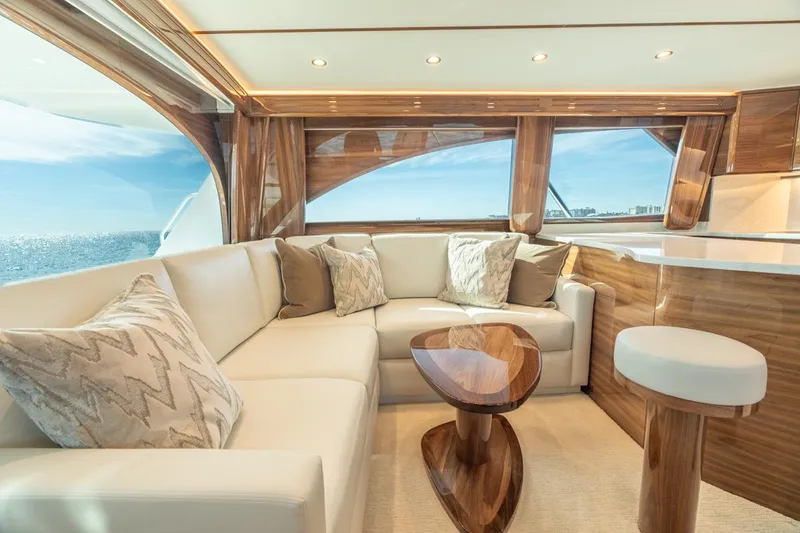Slide: The Image of Luxurious interior of 2025 Viking 54 Convertible yacht with elegant seating and ocean view. - 18