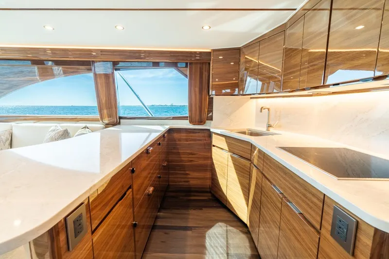 Slide: The Image of Luxurious kitchen interior of 2025 Viking 54 Convertible yacht with ocean view. - 20