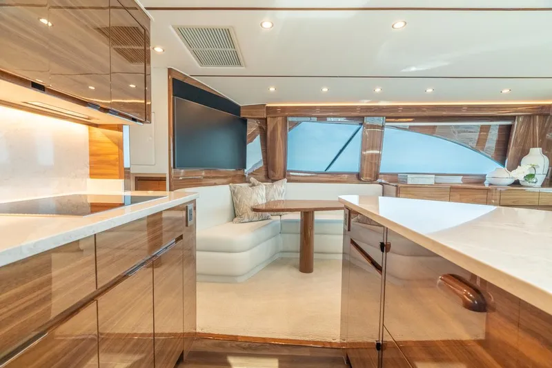 Slide: The Image of Luxurious interior of 2025 Viking 54 Convertible yacht with modern furnishings and elegant design. - 22