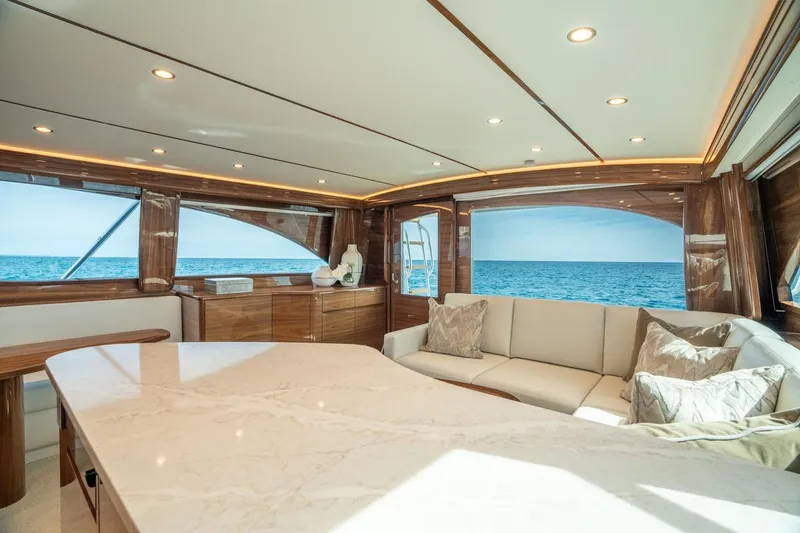 Slide: The Image of Luxurious interior of 2025 Viking 54 Convertible yacht with ocean view. - 23