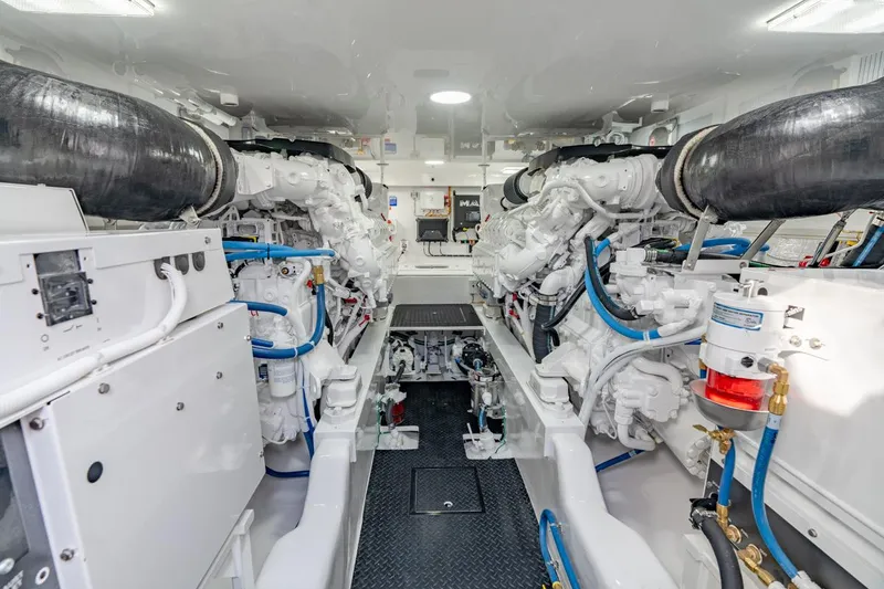 Slide: The Image of Engine room of 2025 Viking 54 Convertible yacht, showcasing dual engines and advanced machinery. - 31
