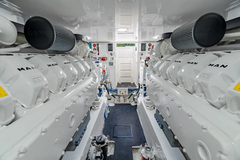 Slide: The Image of Engine room of 2025 Viking 54 Convertible yacht, featuring dual MAN engines. - 32