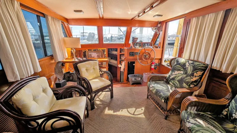 Slide: The Image of Interior of 1986 Heritage East 40 Sundeck yacht with elegant seating and helm. - 11
