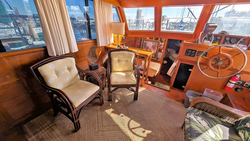 Slide: The Image of Interior of 1986 Heritage East 40 Sundeck yacht with chairs and helm. - 13