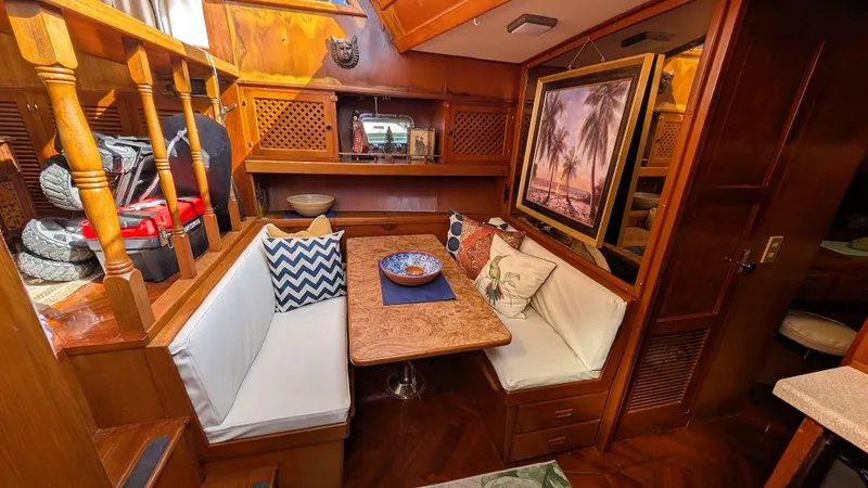Slide: The Image of Cozy interior of 1986 Heritage East 40 Sundeck with dining area and tropical decor. - 21