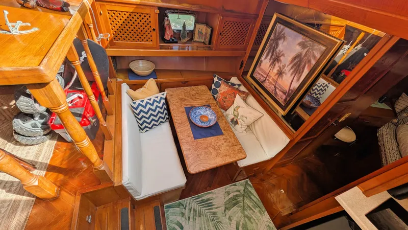 Slide: The Image of Interior of 1986 Heritage East 40 Sundeck with cozy seating and nautical decor. - 23