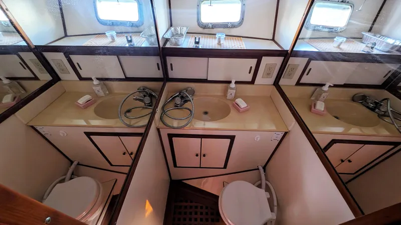 Slide: The Image of 1986 Heritage East 40 Sundeck bathroom with dual sinks and mirrors. - 27