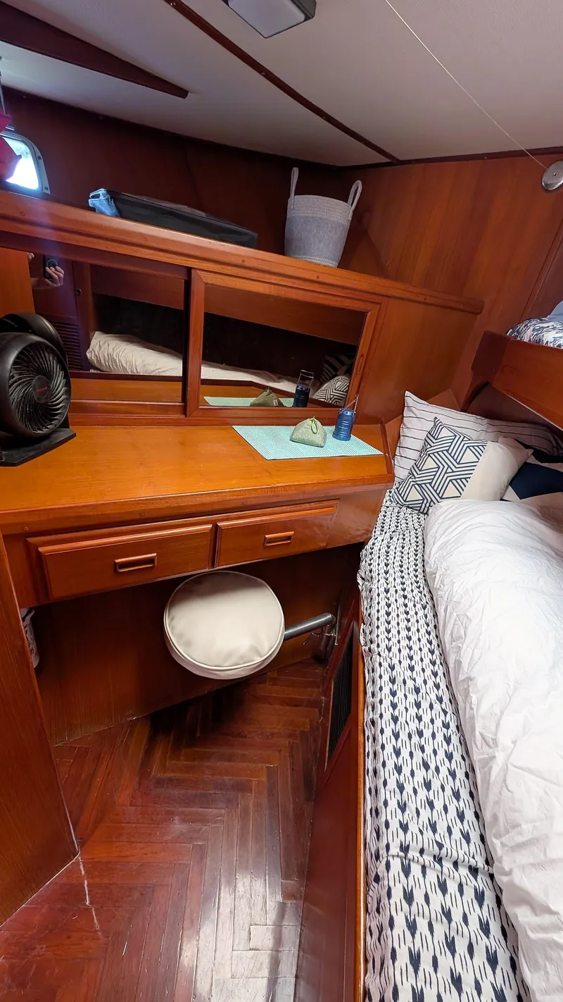 Slide: The Image of 1986 Heritage East 40 Sundeck cabin with wooden interior and cozy bedding. - 29