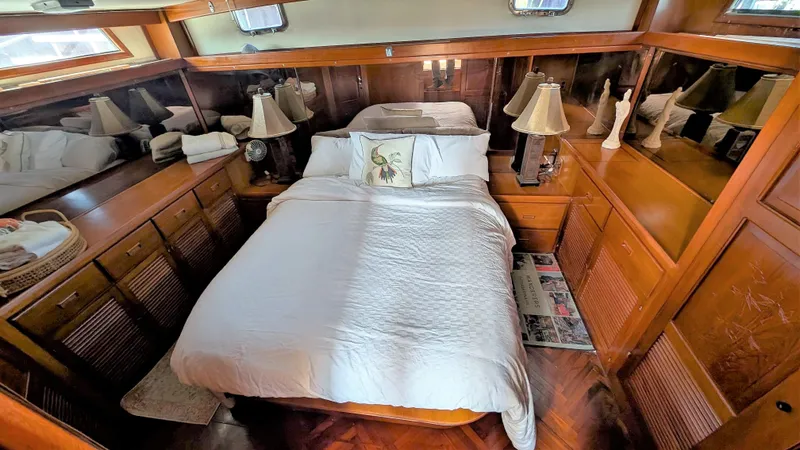 Slide: The Image of Luxurious bedroom interior of 1986 Heritage East 40 Sundeck yacht with wood paneling. - 31