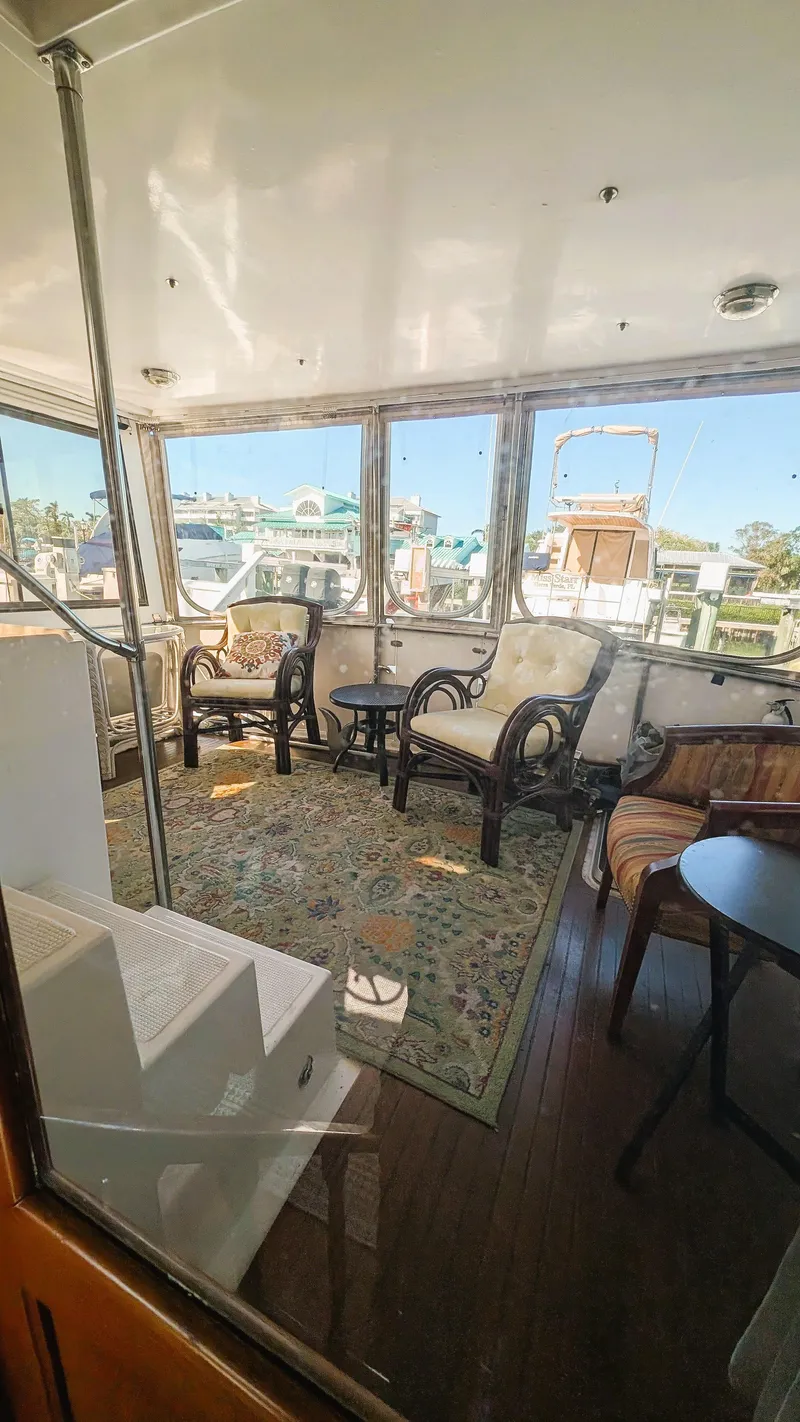 Slide: The Image of 1986 Heritage East 40 Sundeck interior with elegant seating and large windows. - 38
